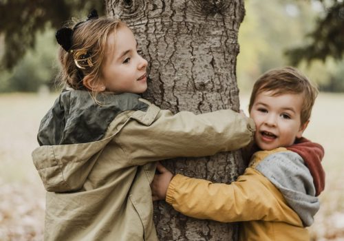 Medium Shot Kids Hugging Tree